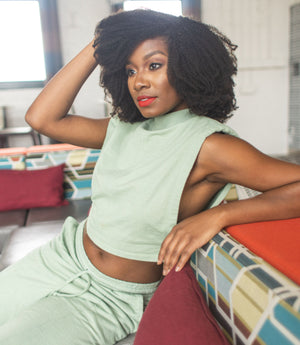 Black woman wearing Heritage1933 Fro Kinks natural hair clip-ins